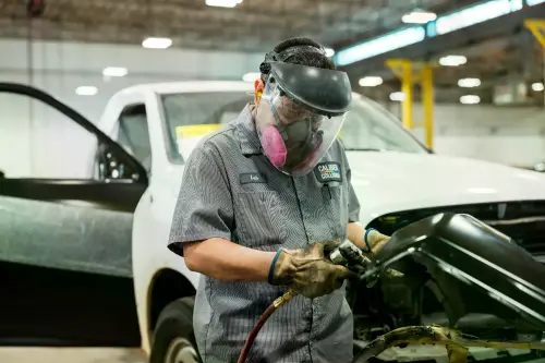 Caliber Collision Body Repair Tech in action.